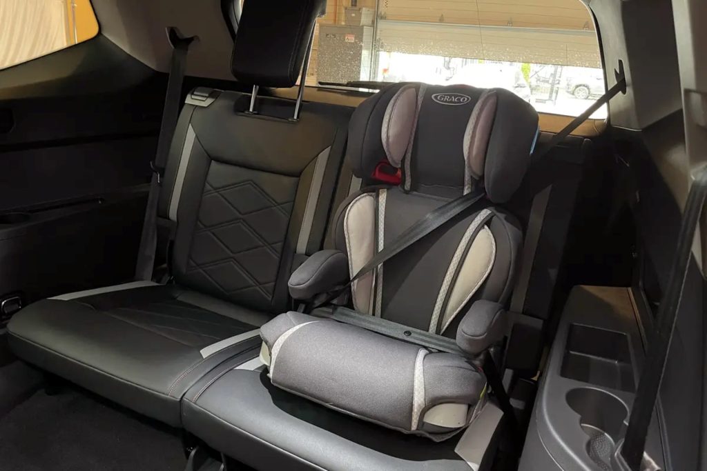 A Buckled Child Seat In The Sleek Back Row Of The Dependable Family Car, The Volkswagen Atlas