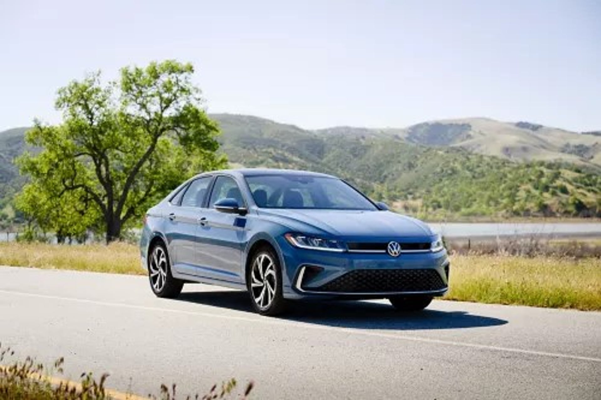 New 2025 Volkswagen Jetta parked on a scenic road