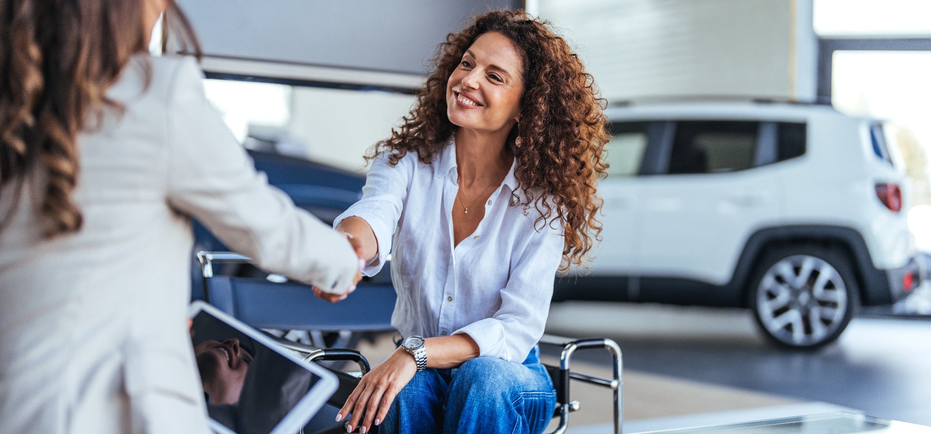 Smiling woman accepting the offer for her vehicle