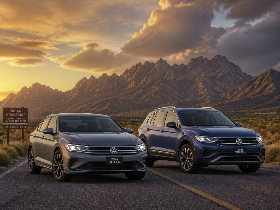 2026 Volkswagen Jetta and Tiguan on a Las Cruces area desert highway with the Organ Mountains in the background